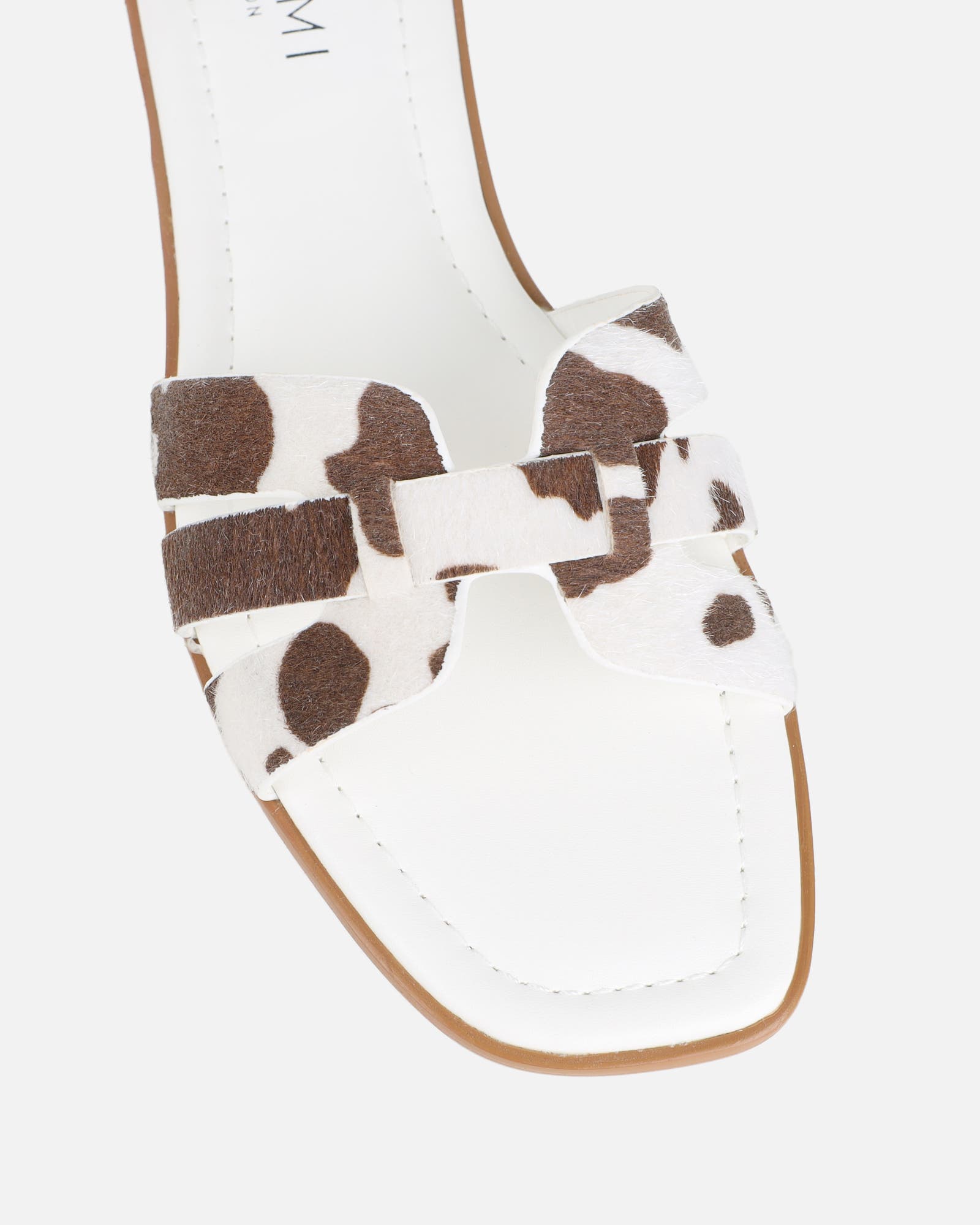 Jorja Cow Print Slip On Flat Sandals | SIMMI London