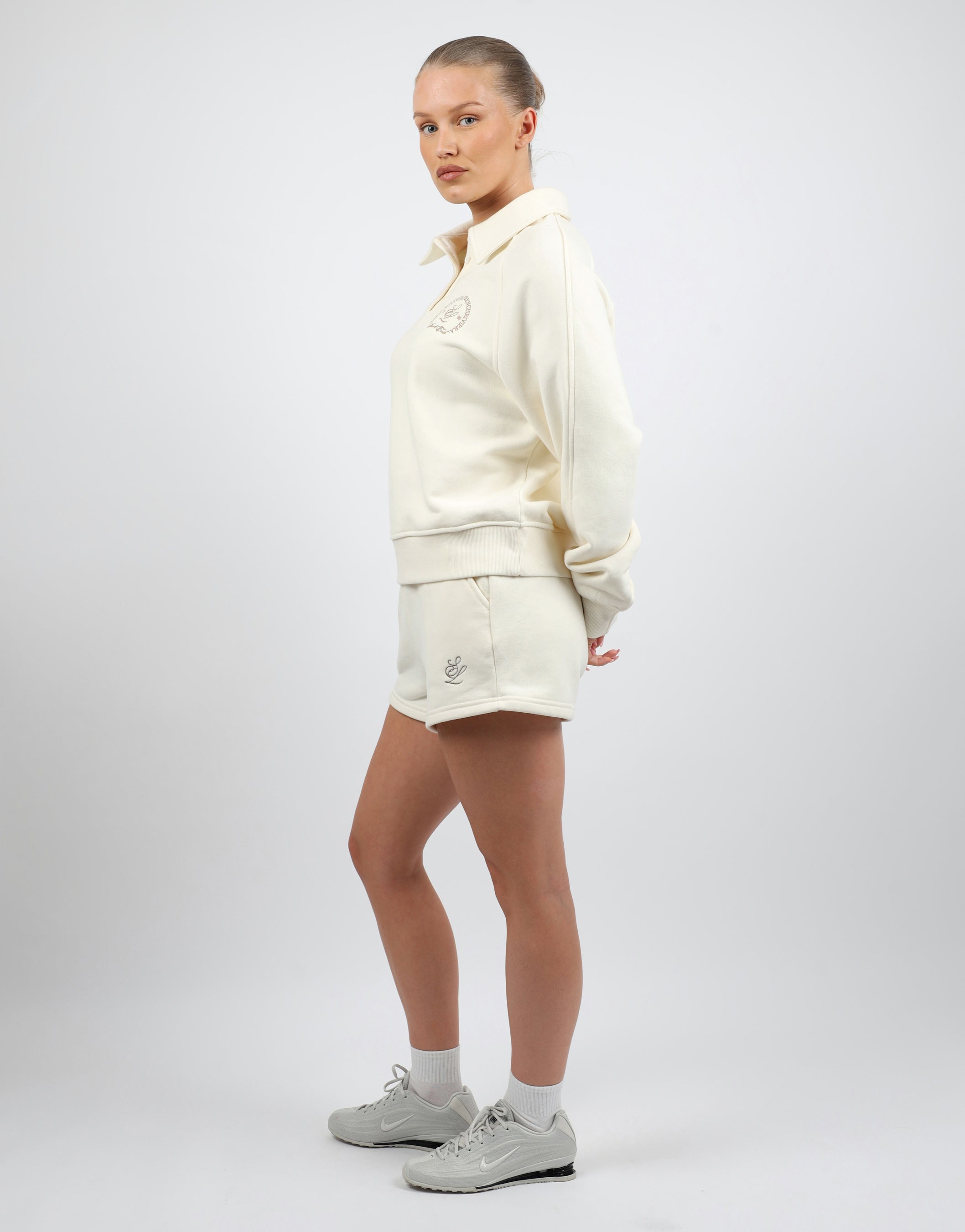 Monaco Simmi Studios Embroidered Logo Polo Sweatshirt In Cream | SIMMI London
