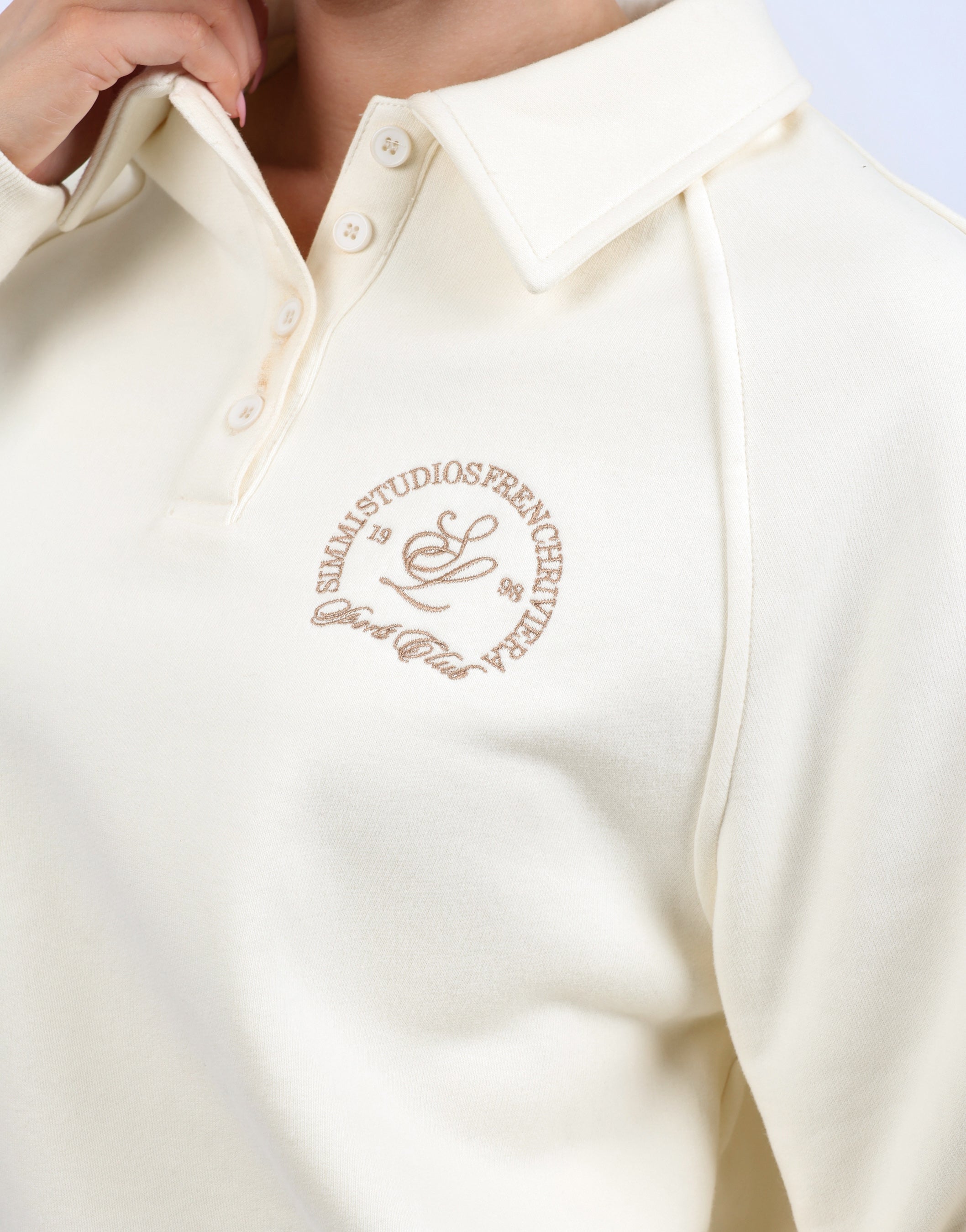 Monaco Simmi Studios Embroidered Logo Polo Sweatshirt In Cream | SIMMI London