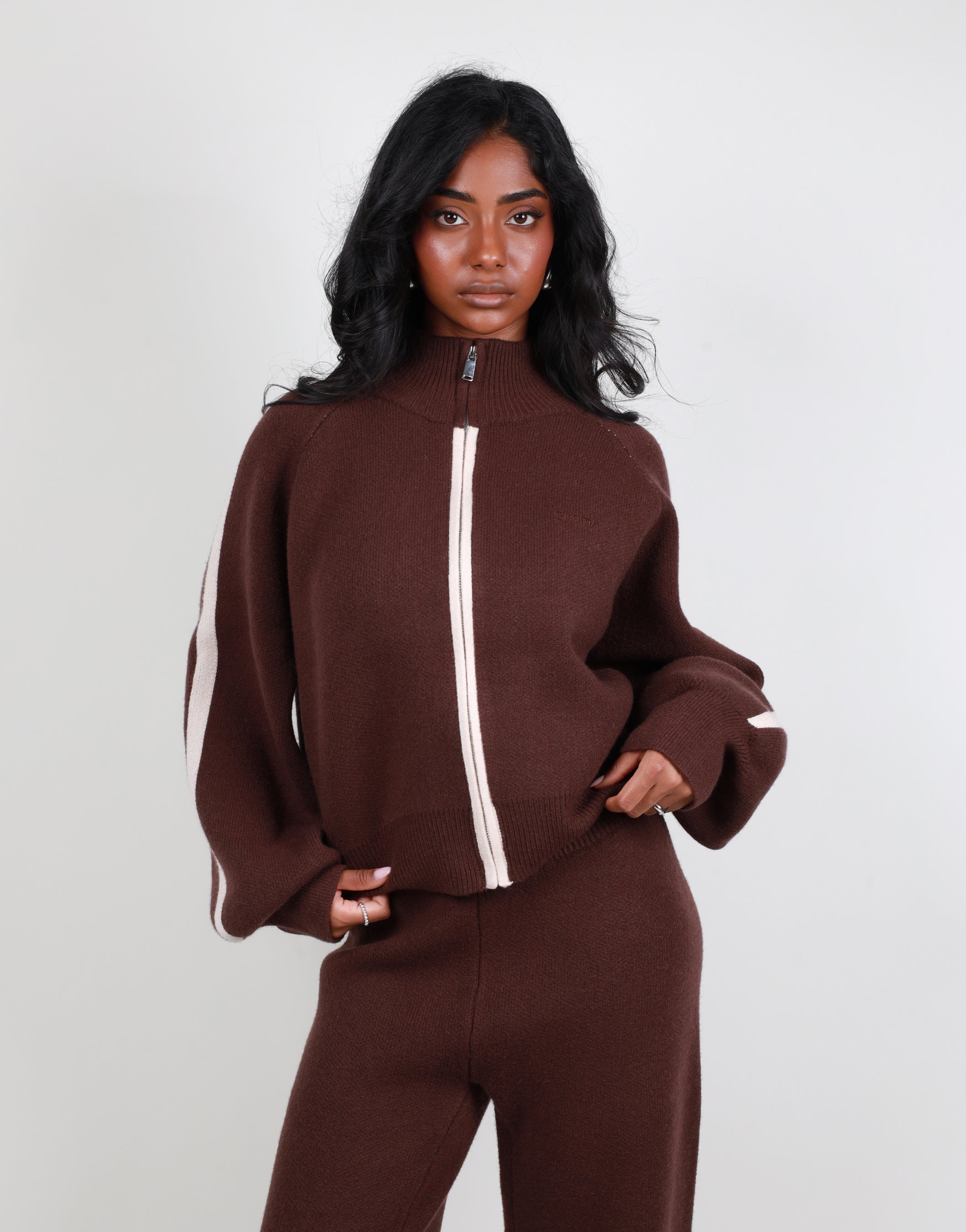 Juliette Stripe jacquard knit high neck zip through in brown | SIMMI London