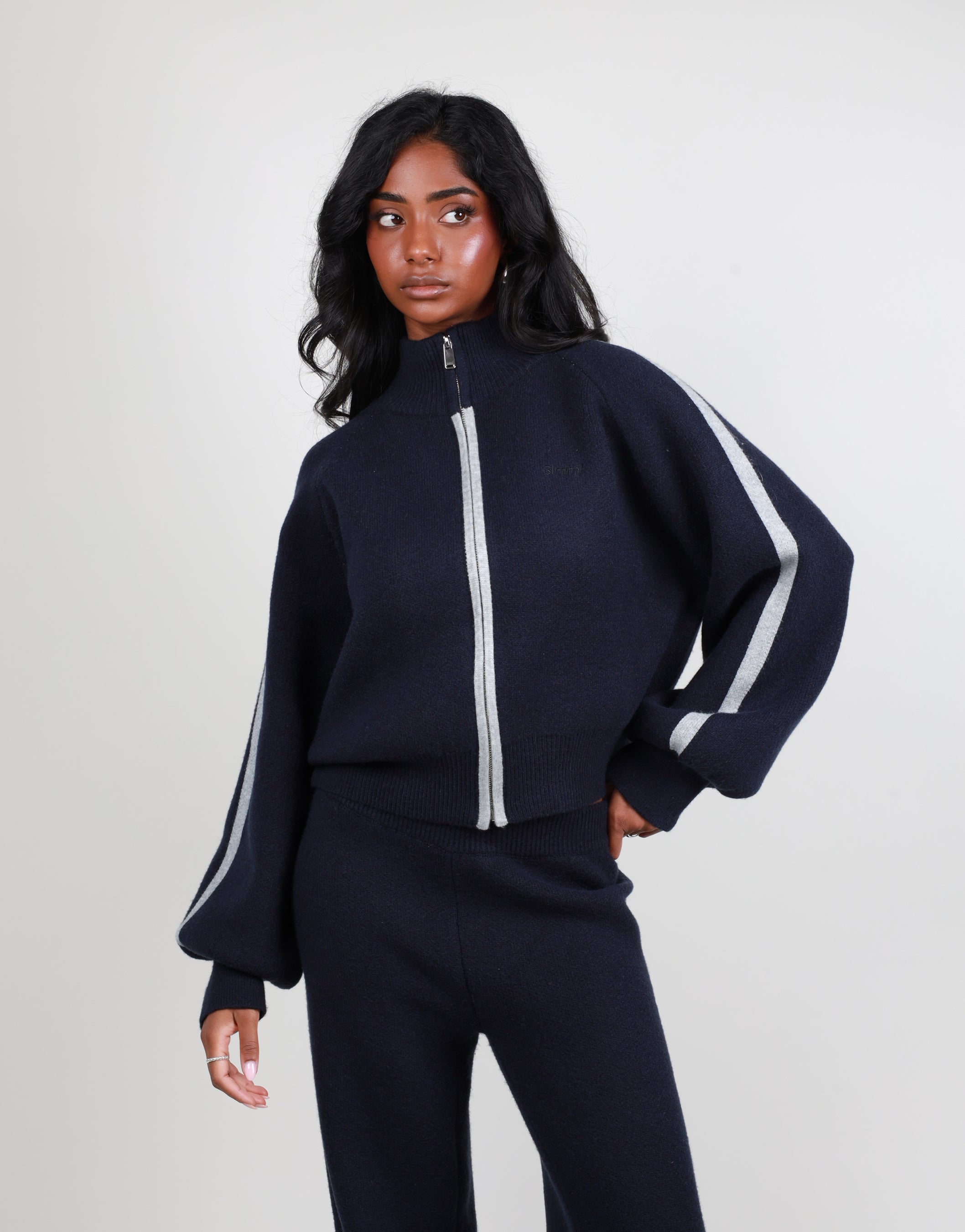 Juliette Stripe jacquard knit high neck zip through in navy | SIMMI London