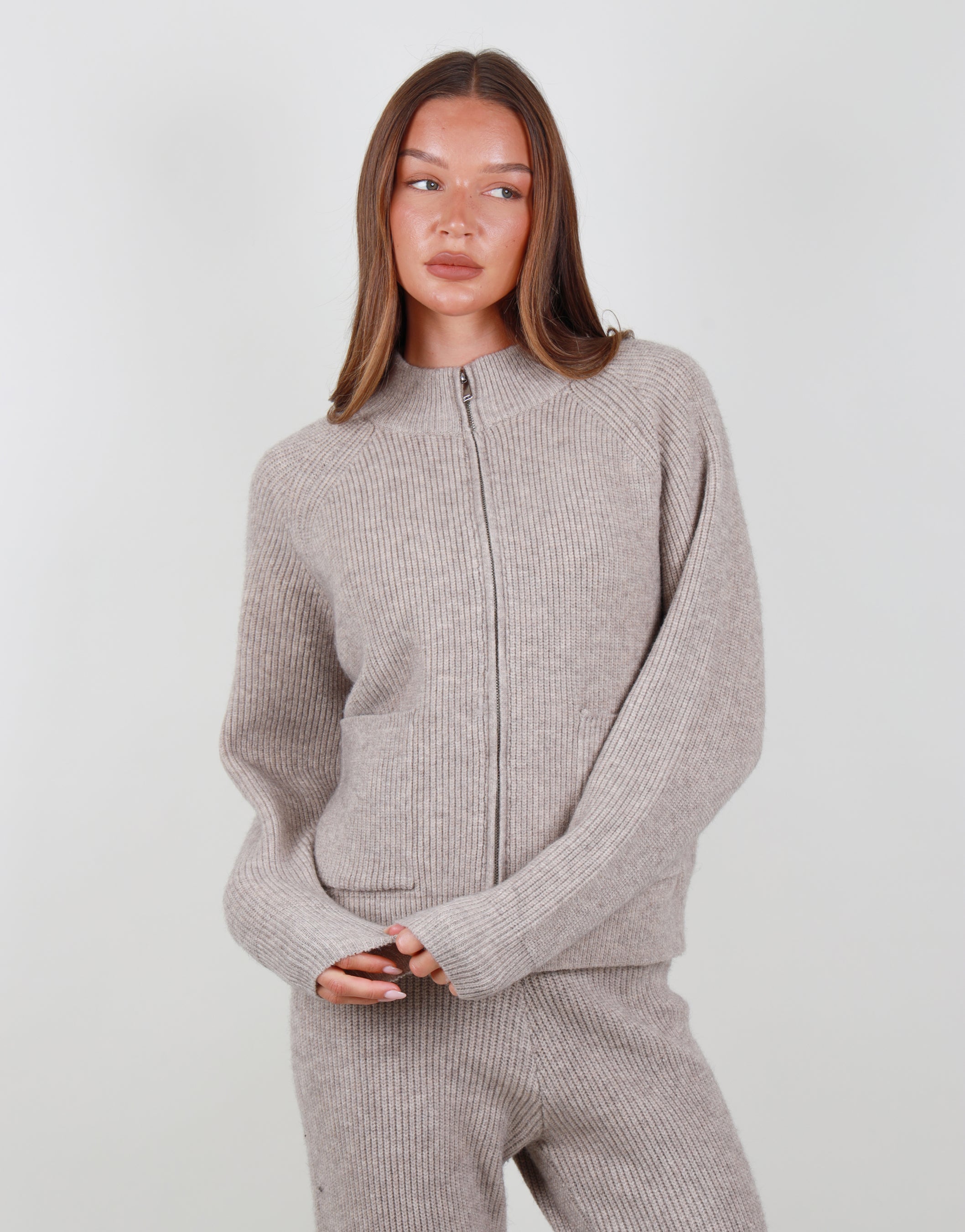Celeste Ribbed Zip funnel neck sweatshirt in beige | SIMMI London