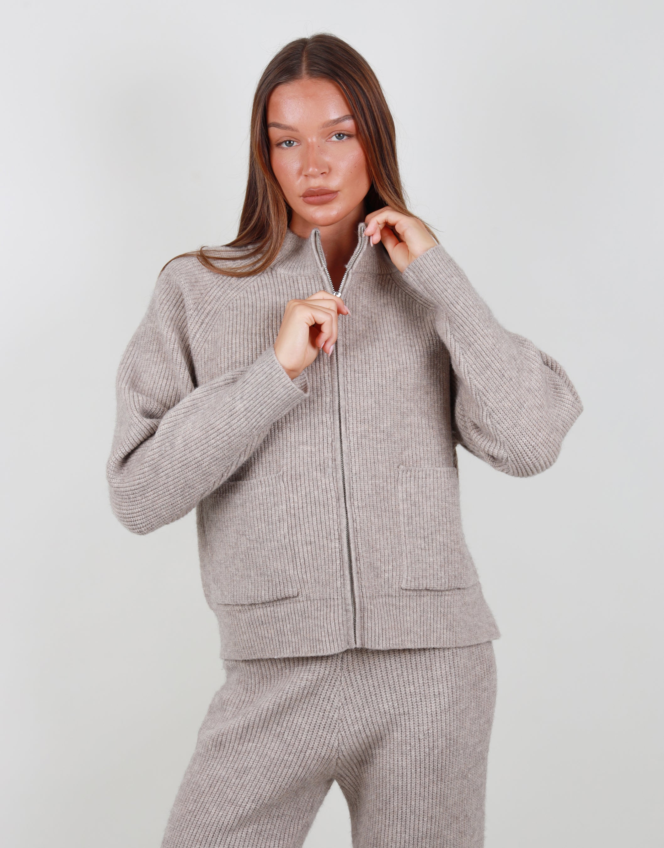 Celeste Ribbed Zip funnel neck sweatshirt in beige | SIMMI London
