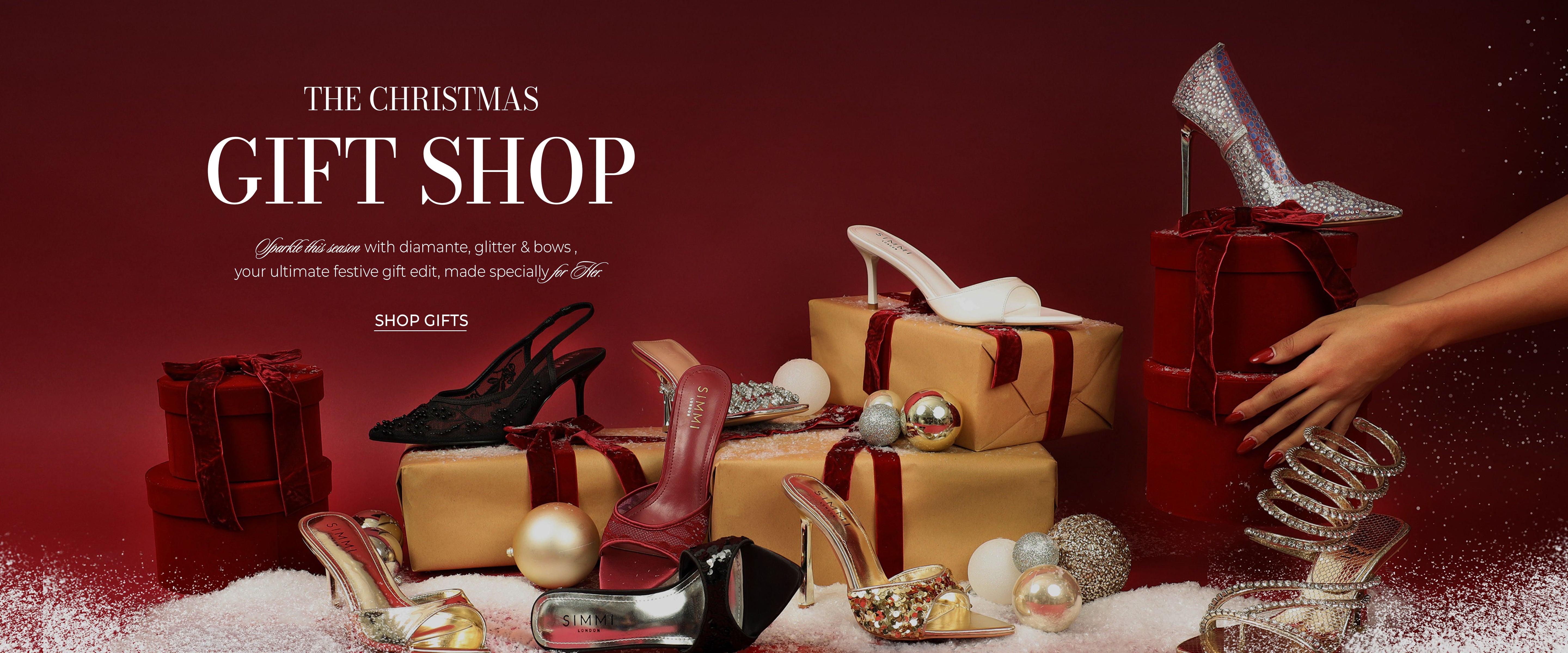 Promotional image of a Christmas gift shop with shoes and presents on a red background.