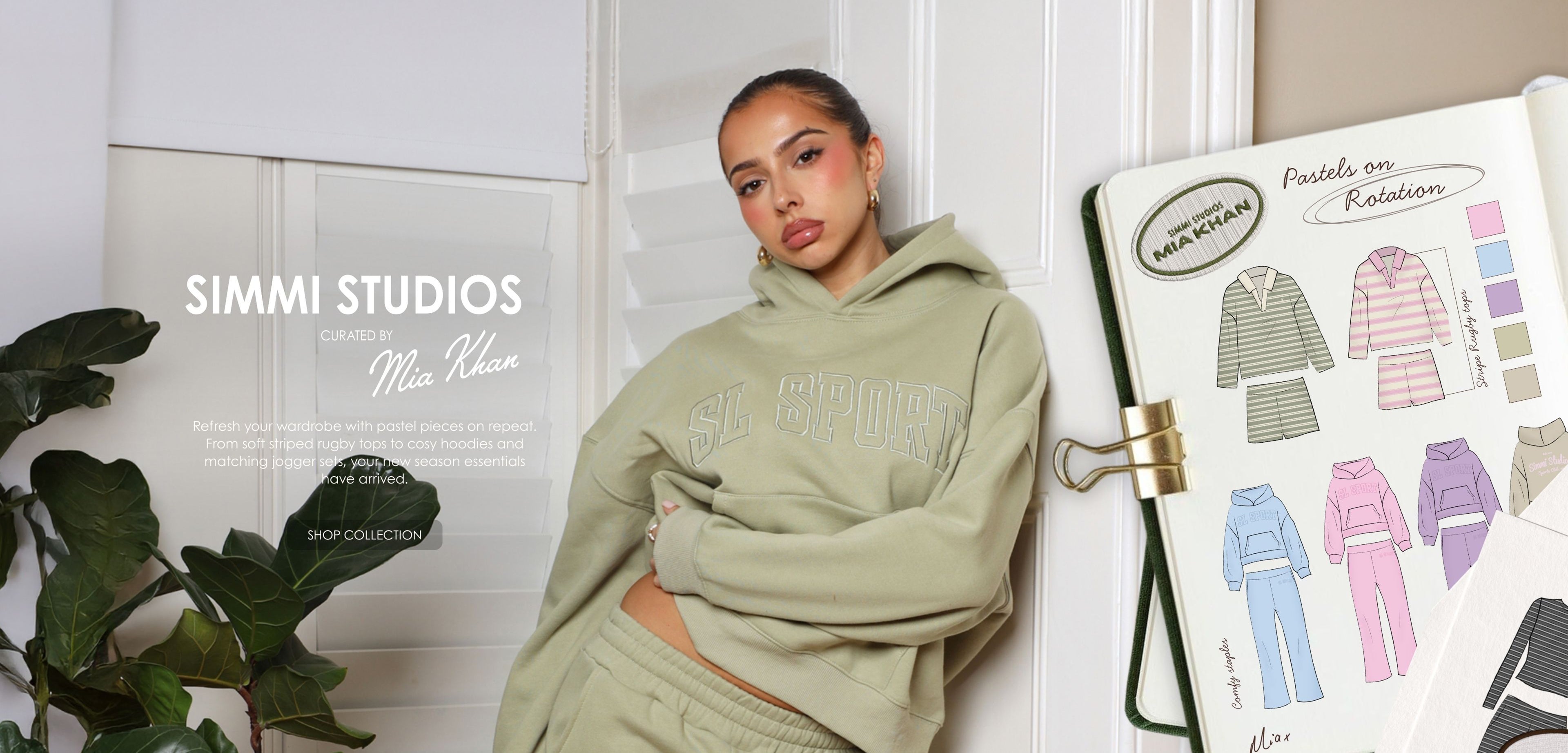 Person wearing a green hoodie with 'Simmi Studios' branding against a white wall.