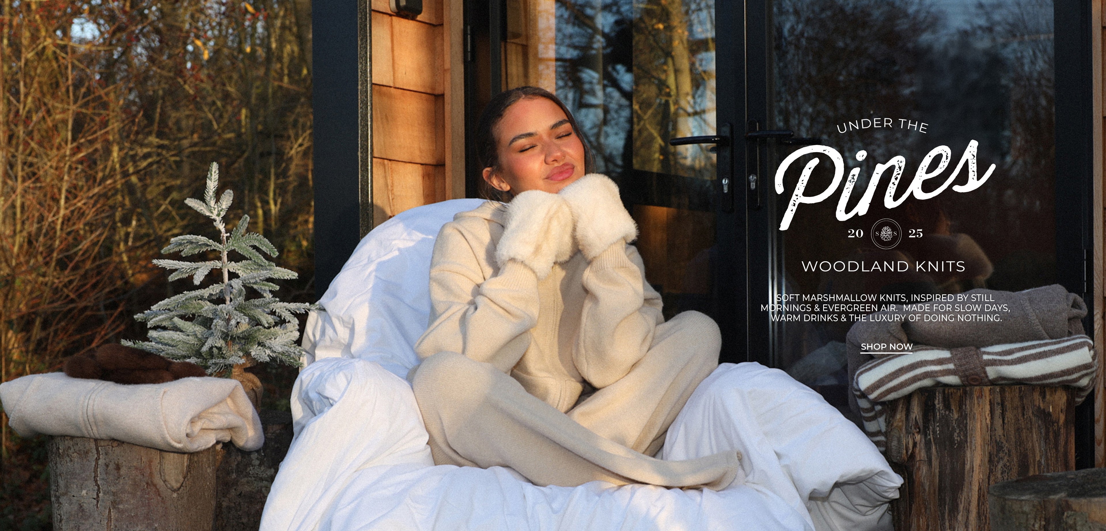 Person sitting in a cozy outdoor setting with 'Under the Pines' branding.