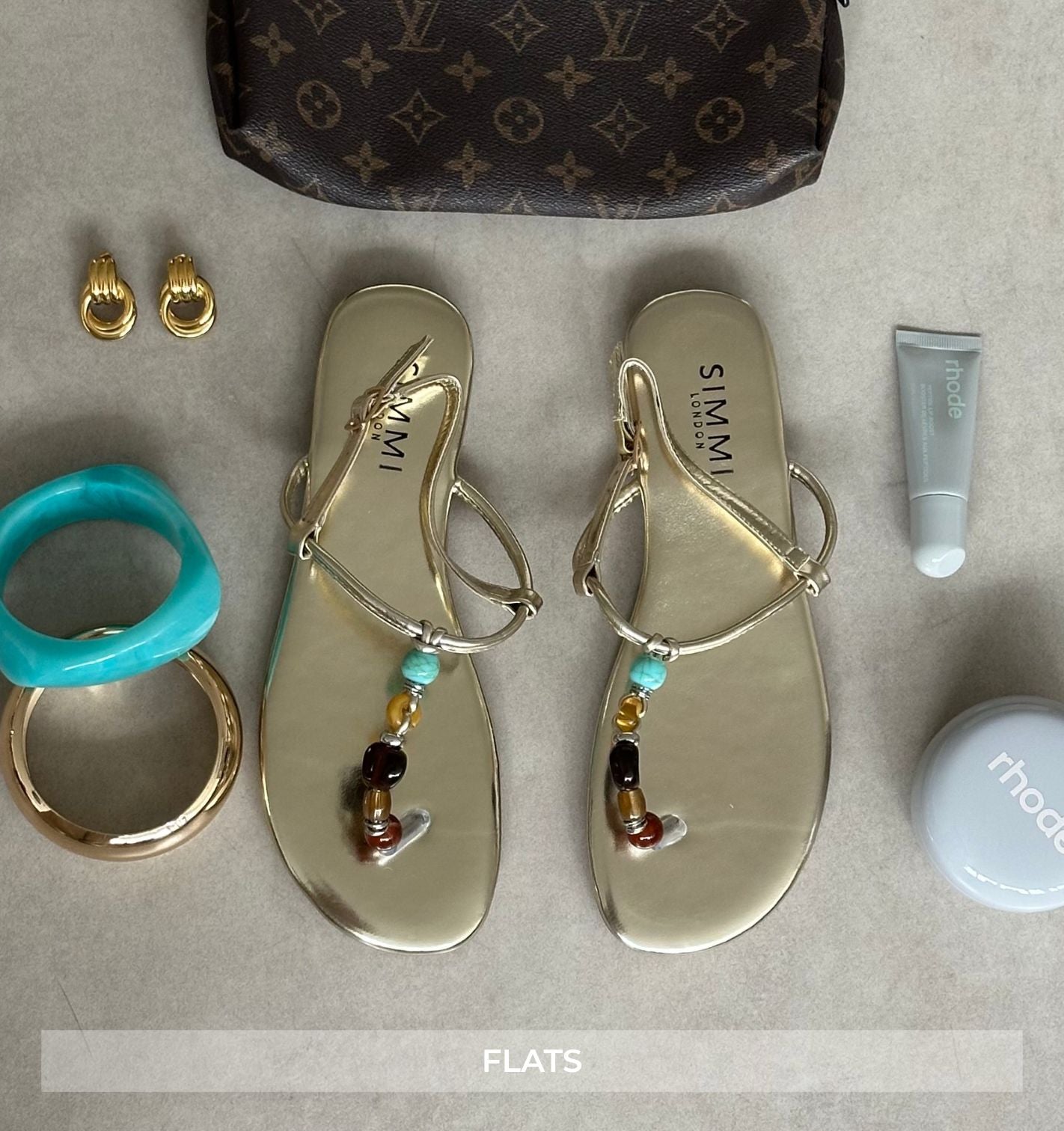 gold glats with embellishment with accessories and logo bag | SIMMI london