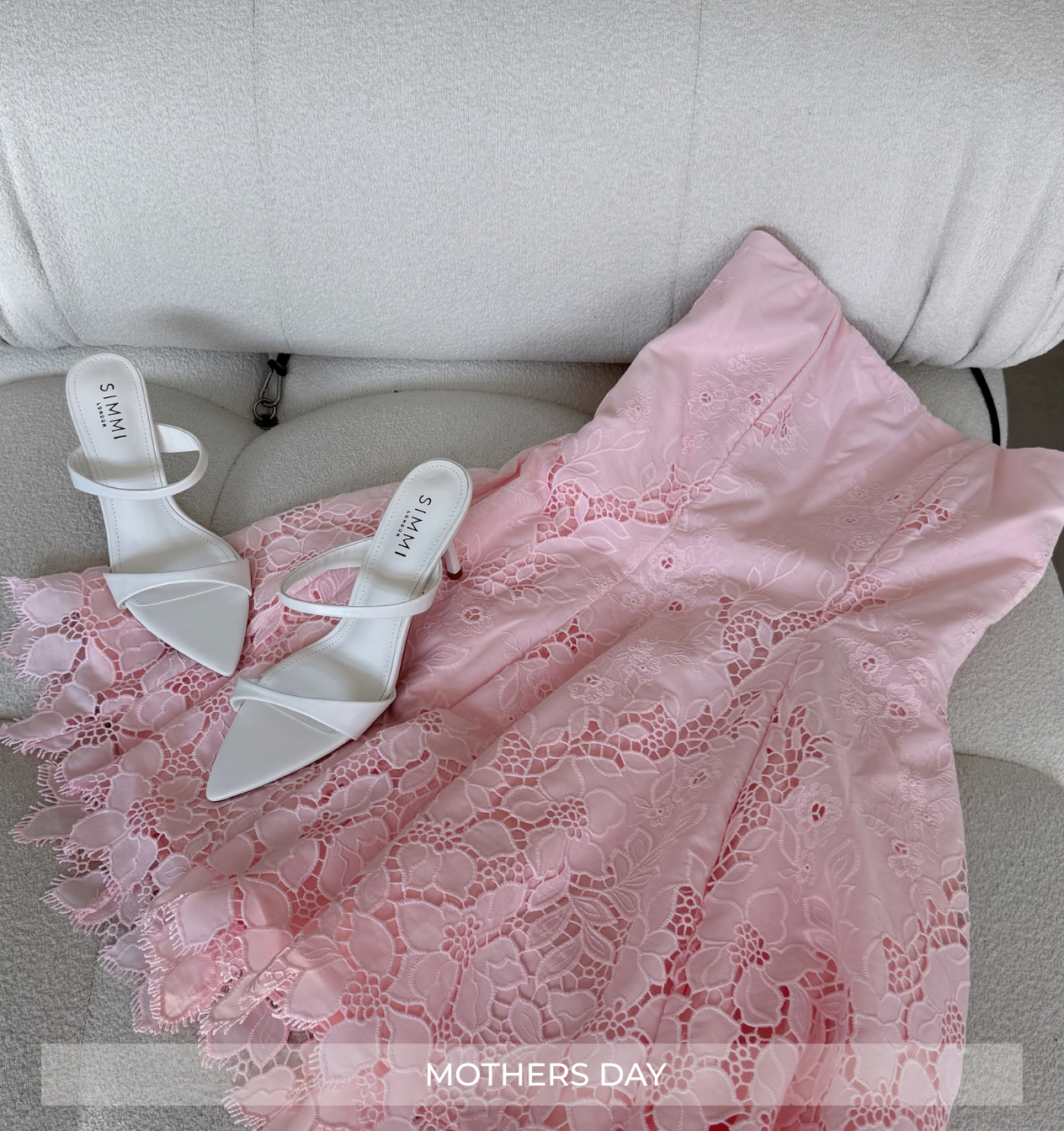 Pink lace dress with white sandals on a gray couch, labeled 'Mothers Day'.