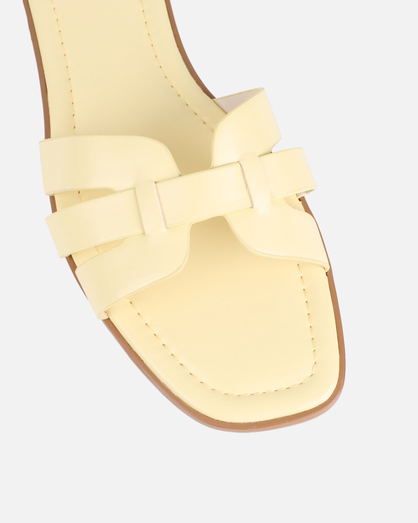 Jorja Butter Yellow Slip On Flat Sandals | SIMMI London