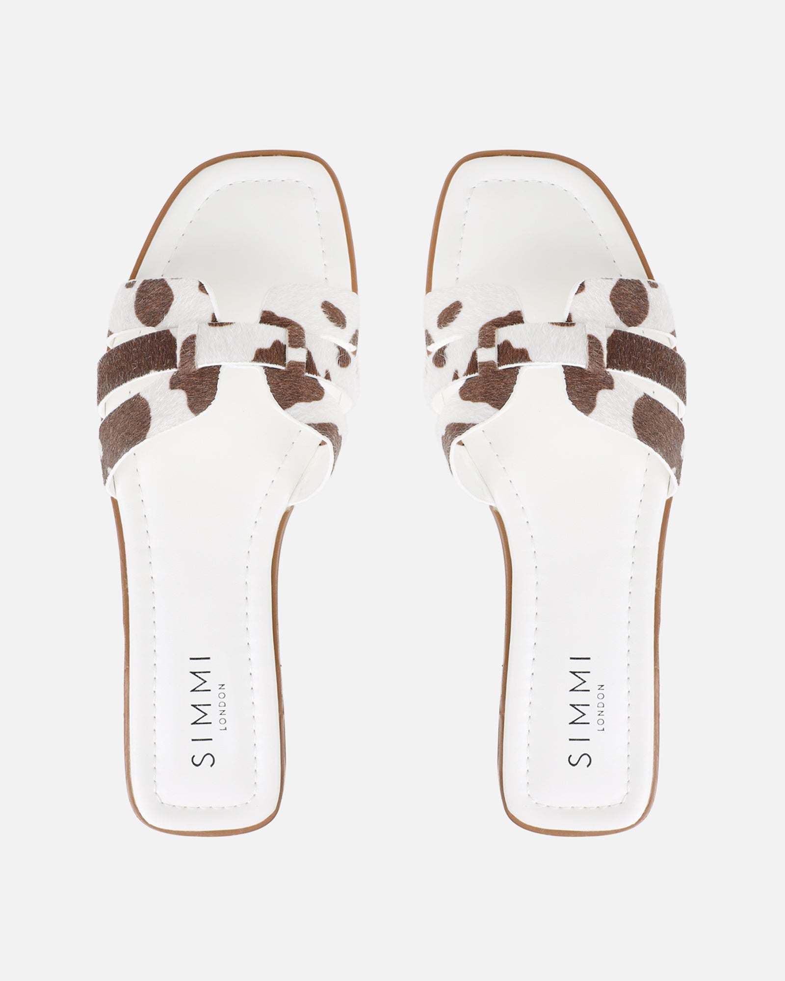 Jorja Cow Print Slip On Flat Sandals | SIMMI London