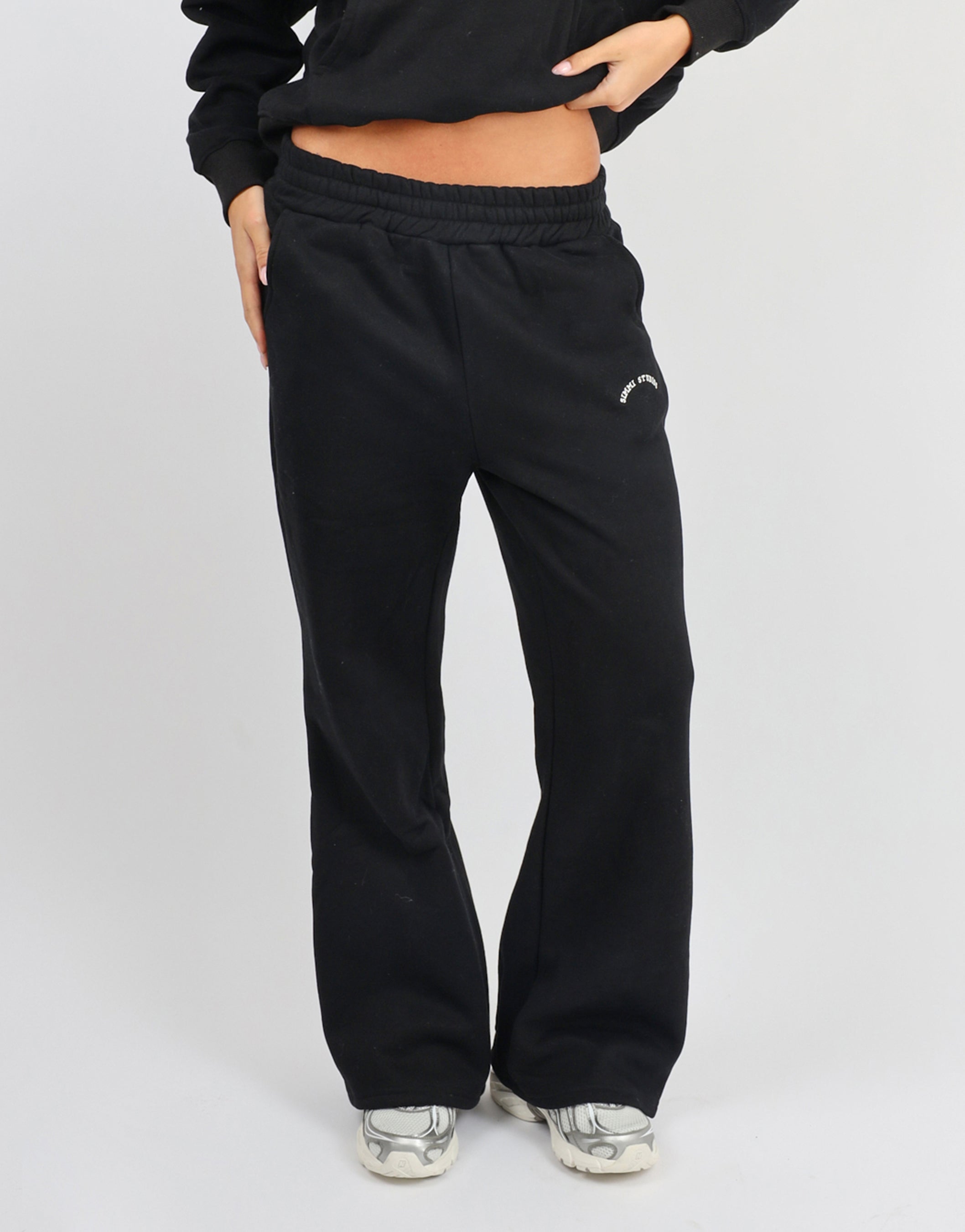 Colby Varsity Flared joggers in Black | SIMMI London