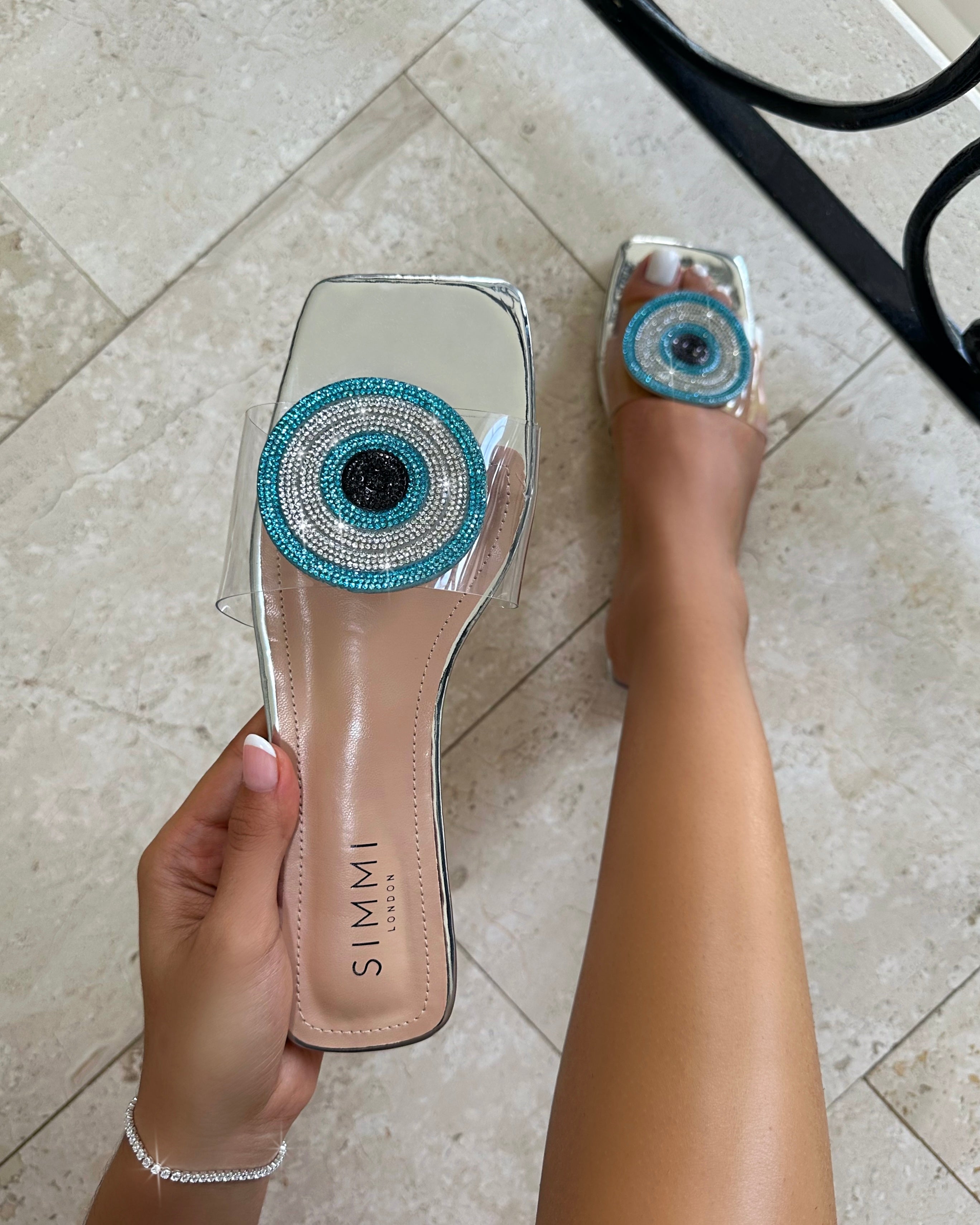 Clem Clear Silver Mirror Evil Eye Flat Sandals | SIMMI London