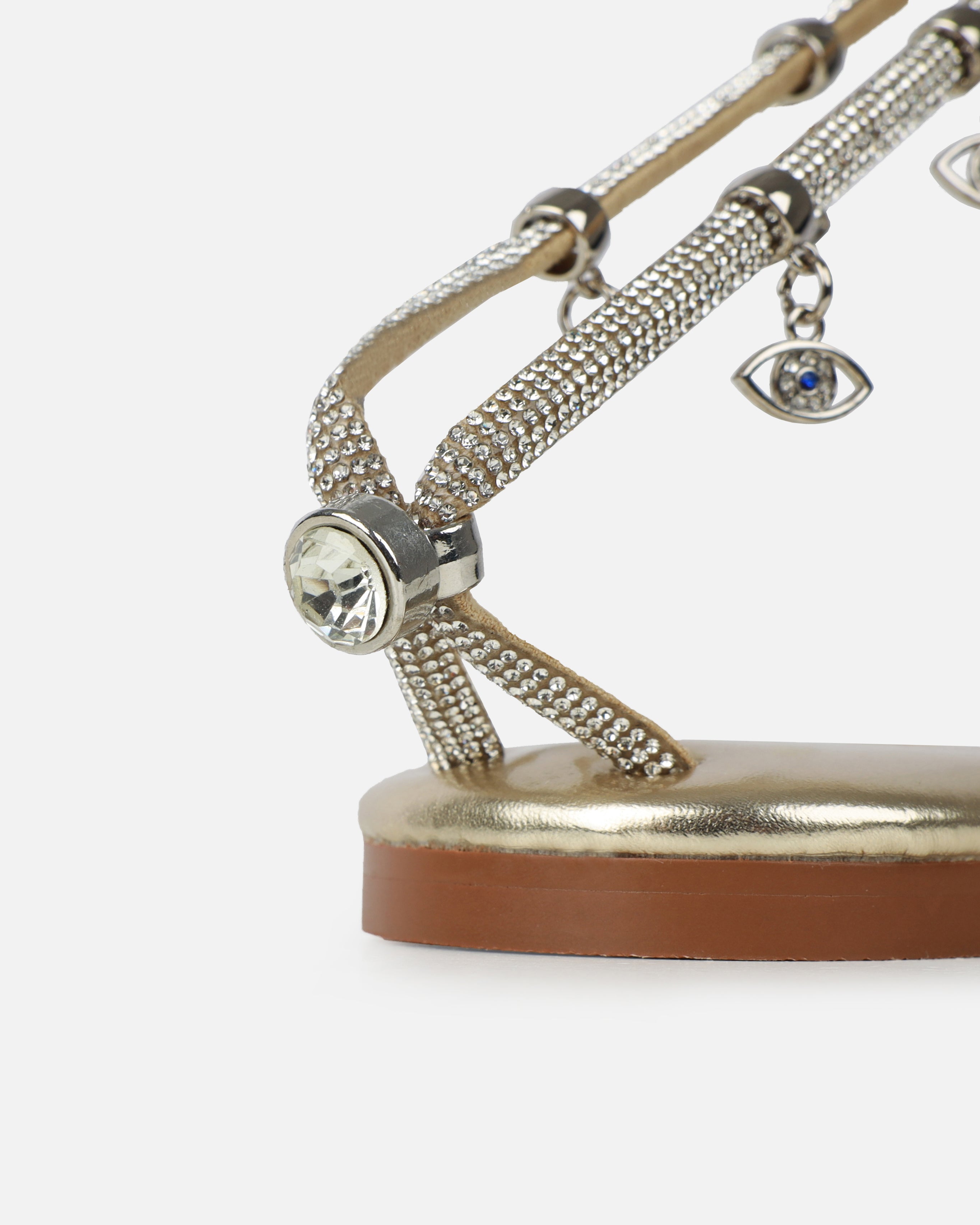Dakoa Gold Metallic Evil Eye Charm Flat Sandals | SIMMI London