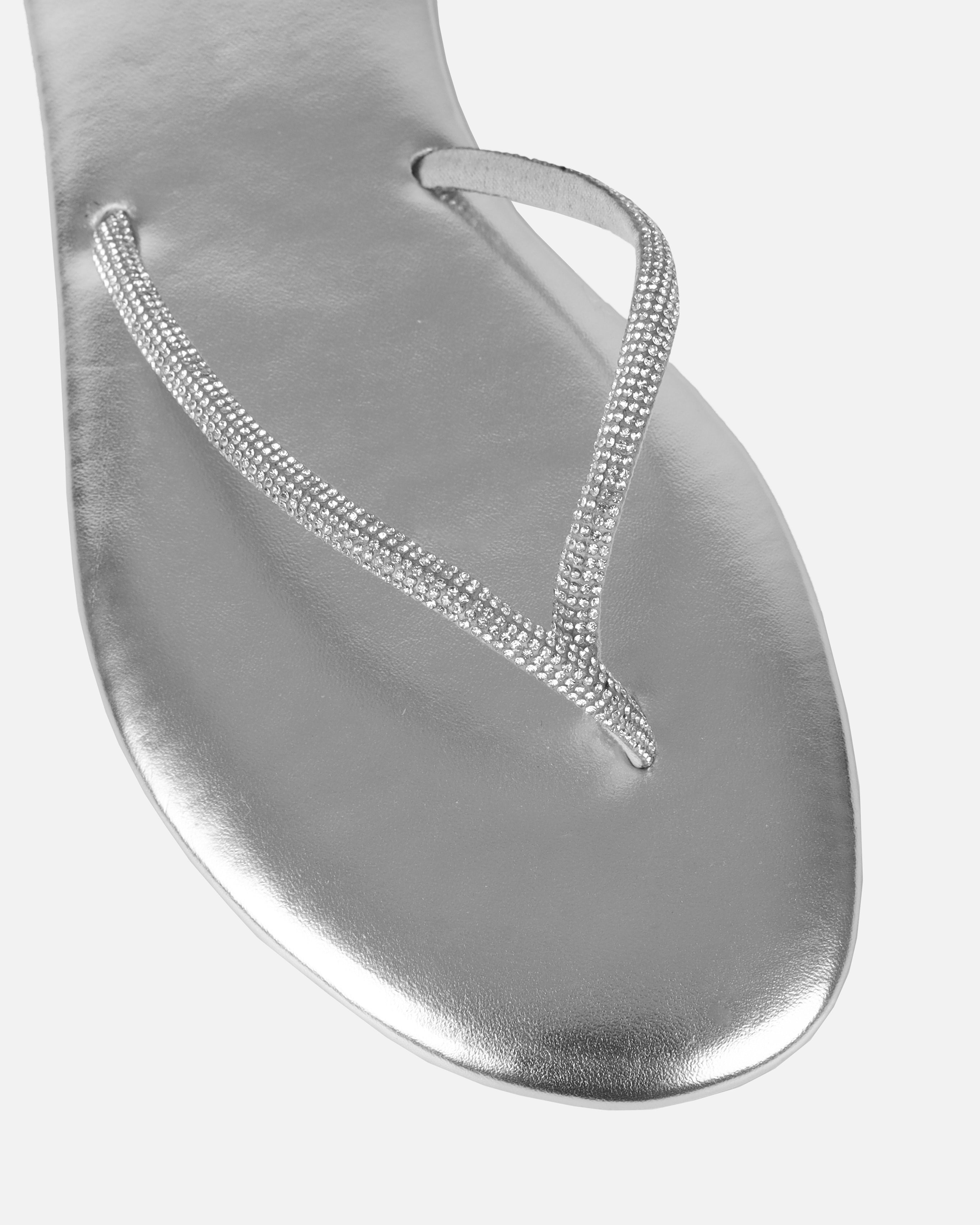 Dakoa Silver Metallic Evil Eye Charm Flat Sandals | SIMMI London