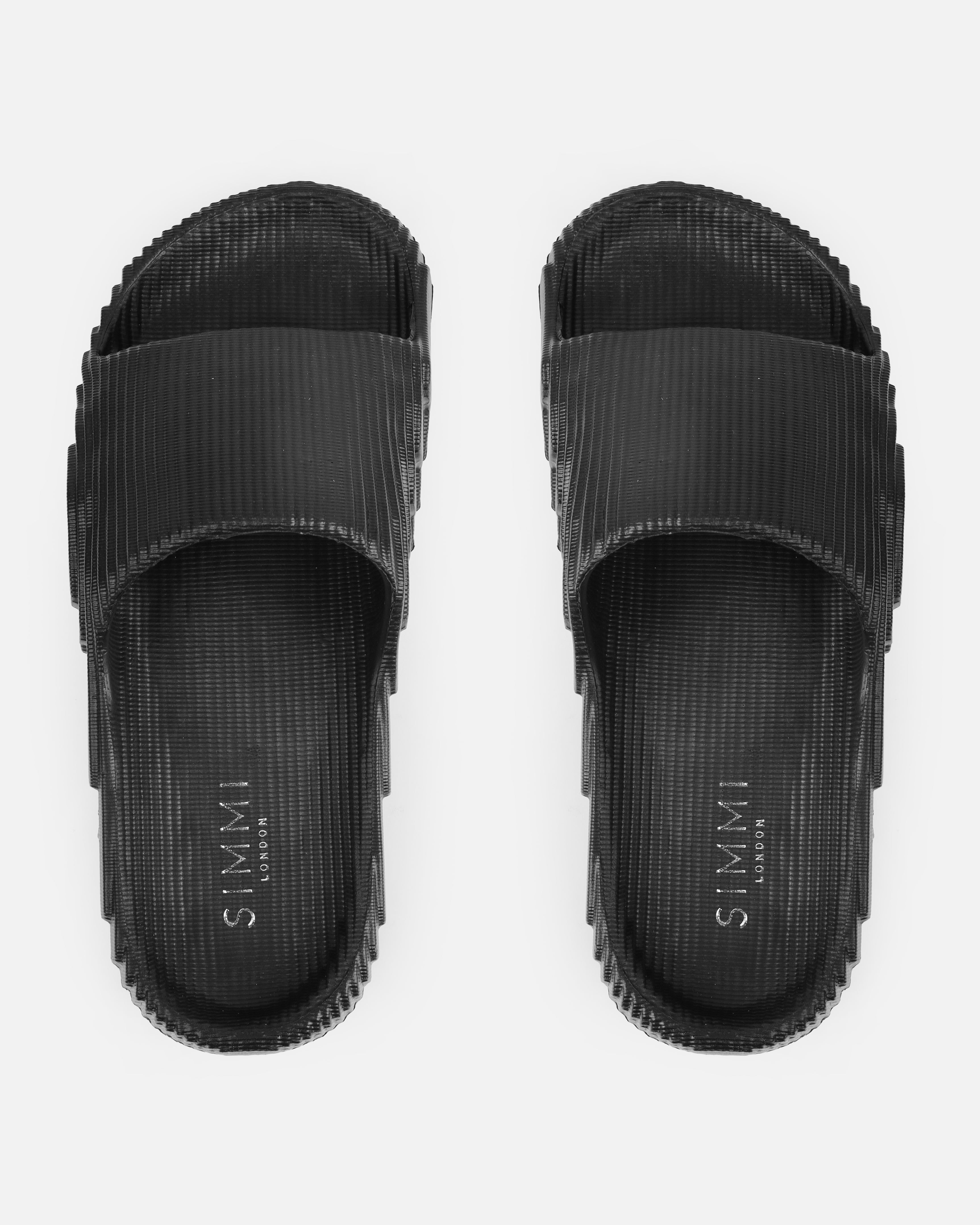 Tazia Black Textured Moulded Flat Slides | SIMMI London