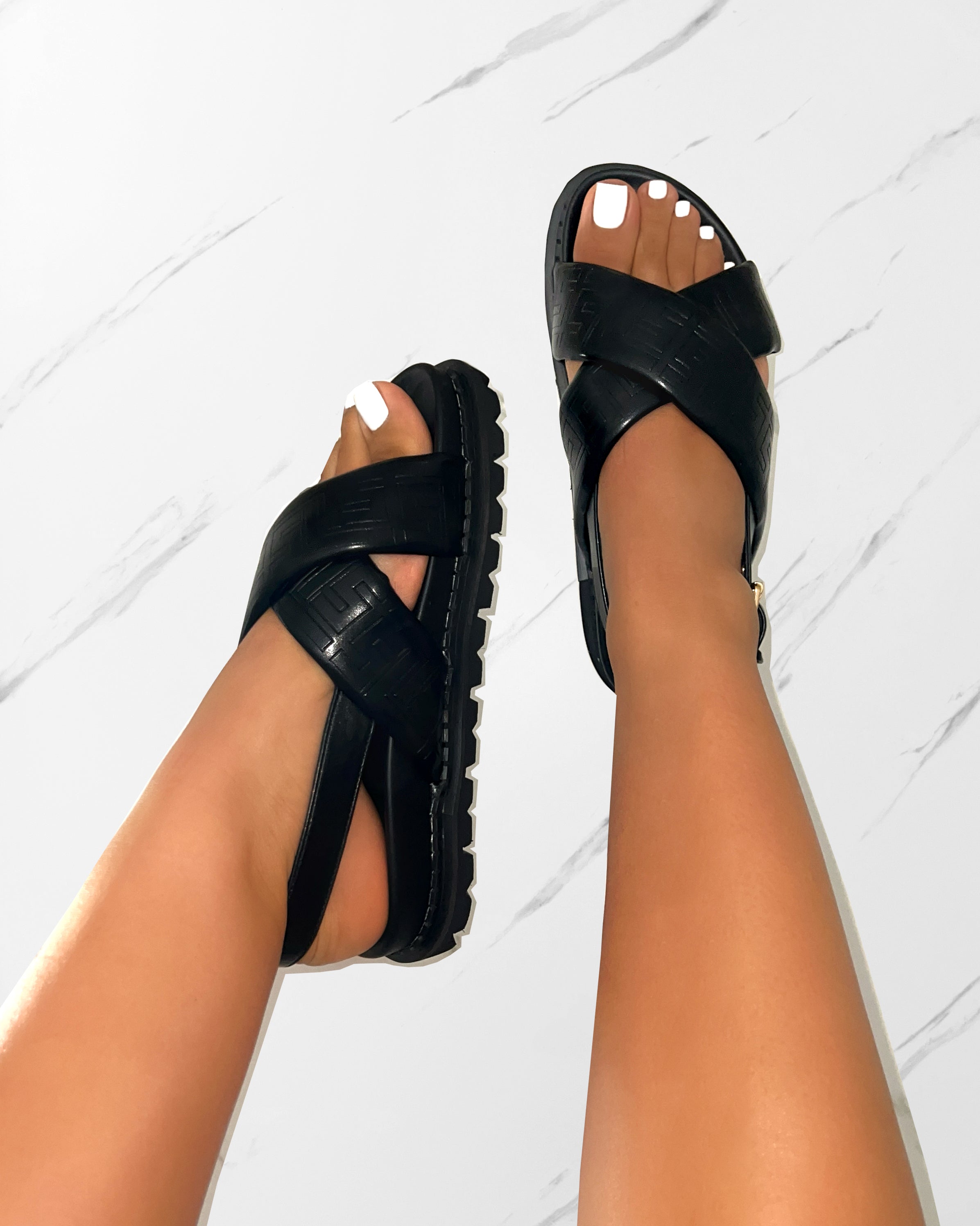 Vaia Black Embossed Cross Over Flat Sandals | SIMMI London
