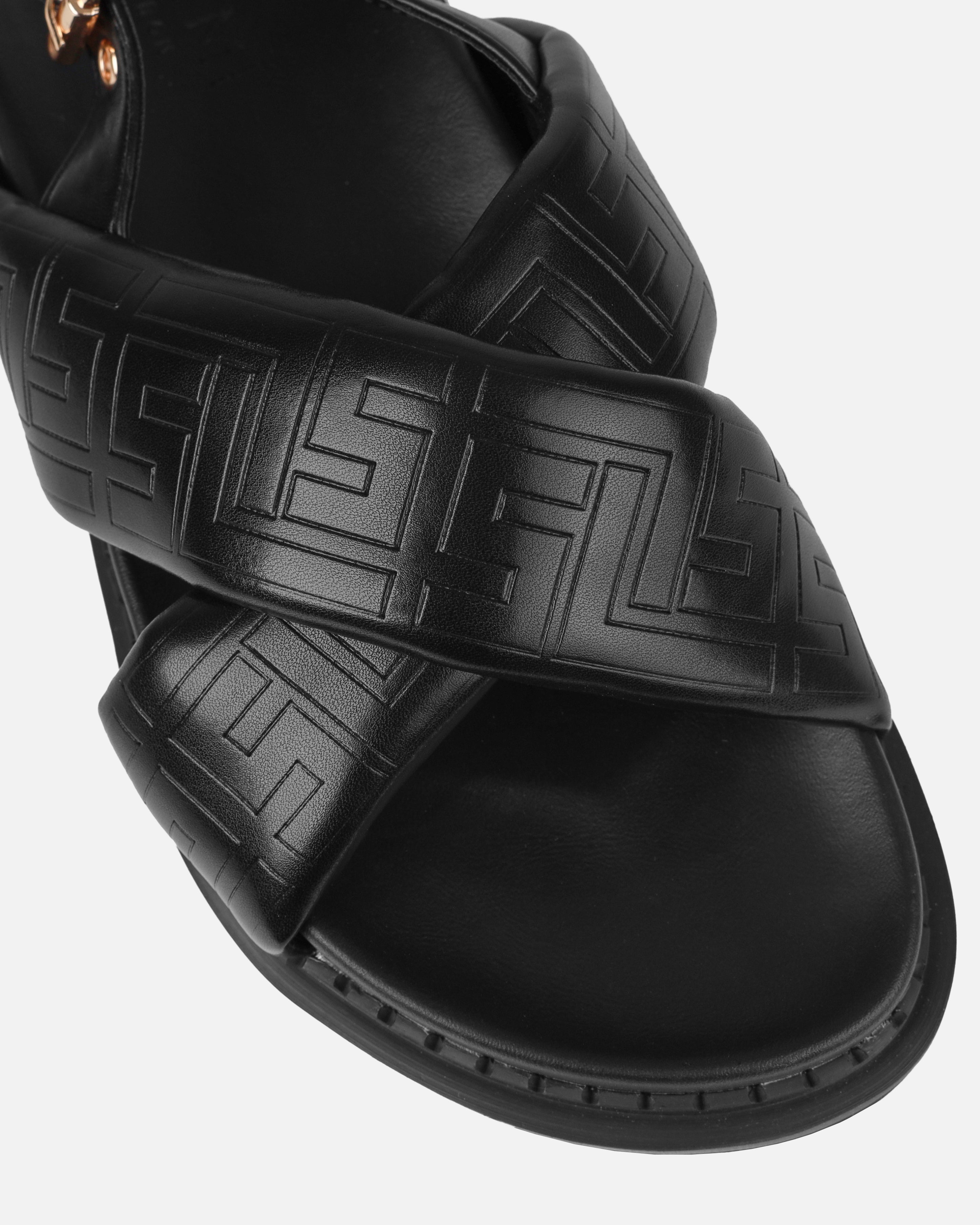 Vaia Black Embossed Cross Over Flat Sandals | SIMMI London