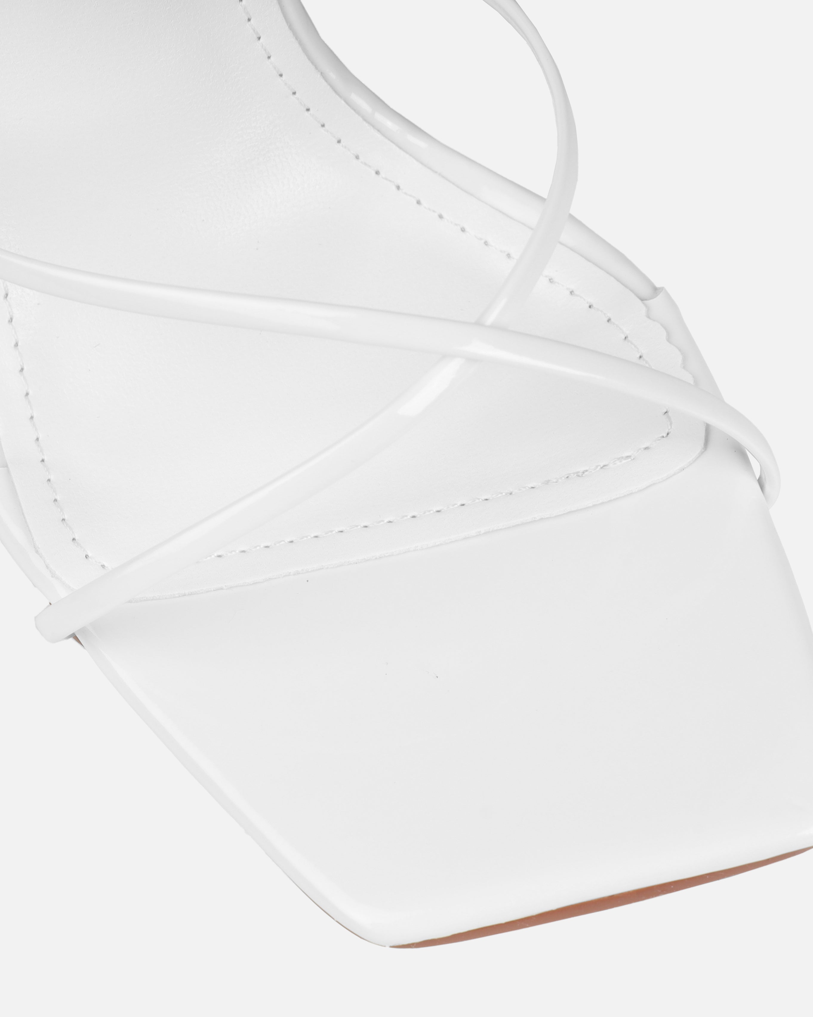 Tasha Ghouri Darii White Patent Flared Stiletto Heels | SIMMI London